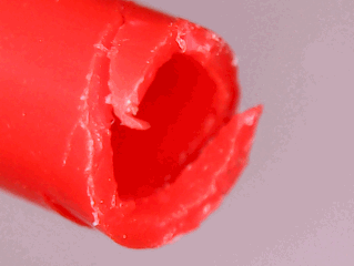 Notches on a tube under a microscope